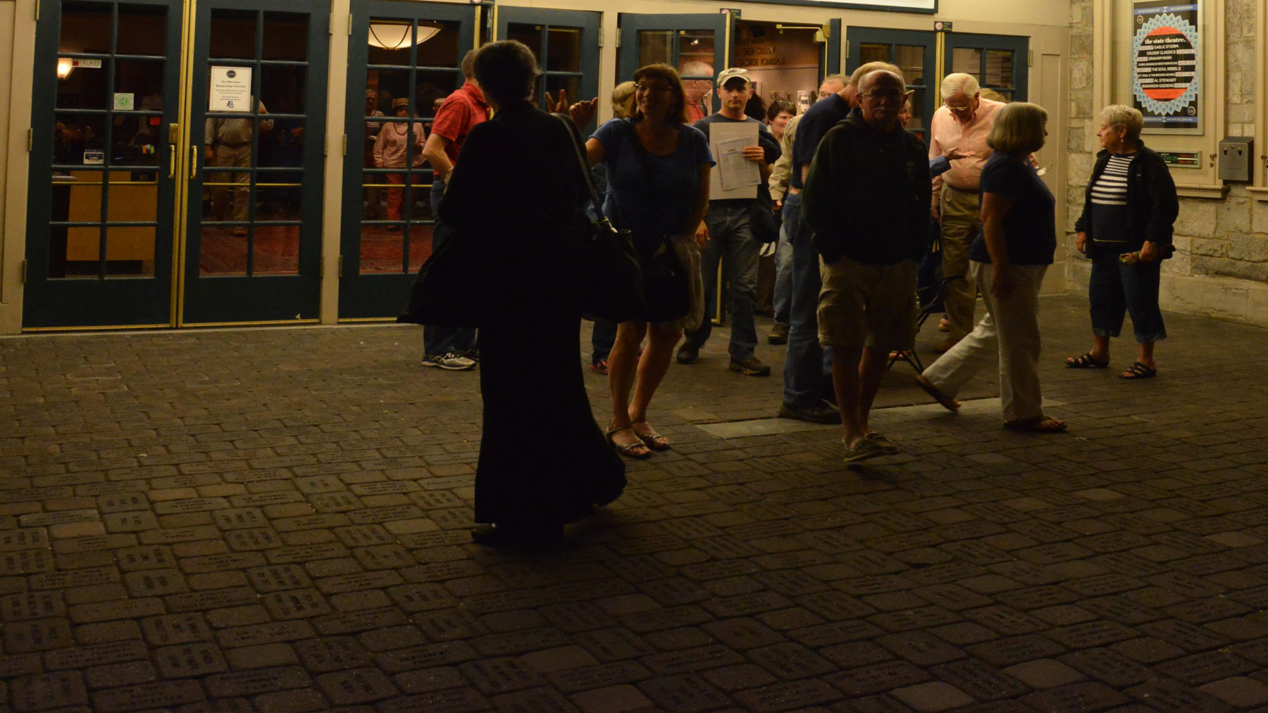 A crowd exiting an event at a local community theater.